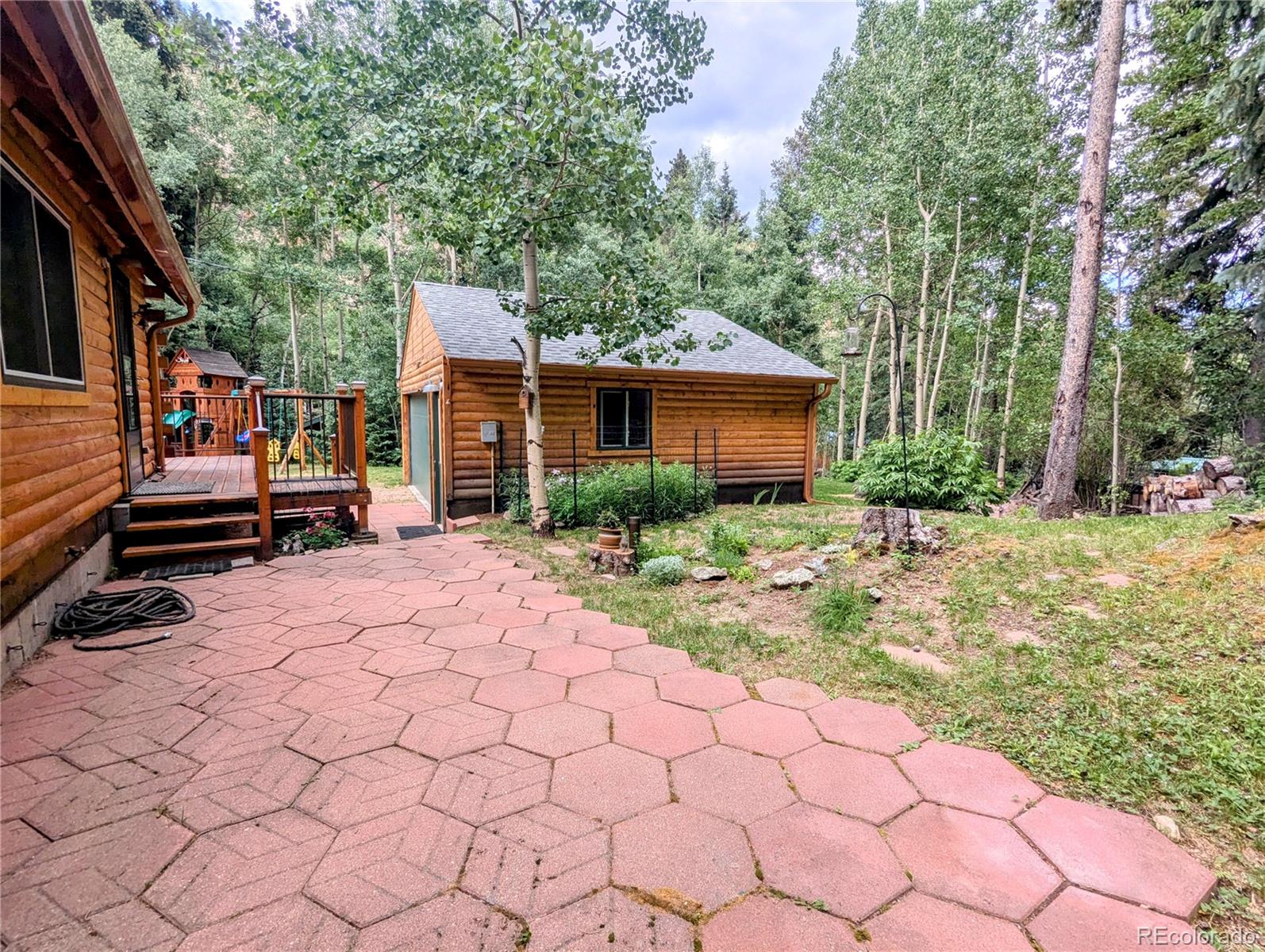 7721 County Road 43 Bailey, CO 80421 - Photo 44 of 49 a front view of a house with garden