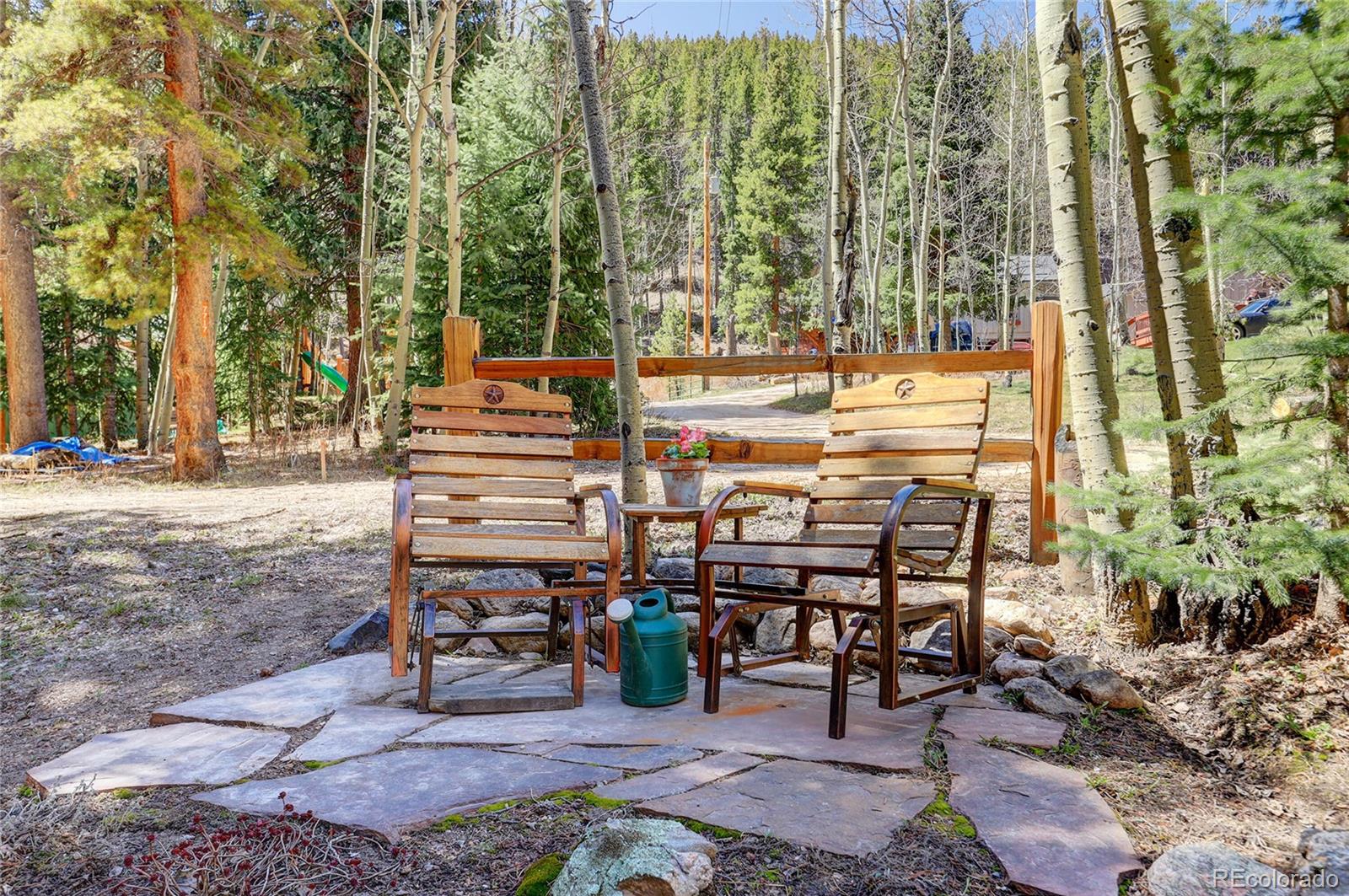 7721 County Road 43 Bailey, CO 80421 - Photo 8 of 49 a view of a chairs and table in the patio