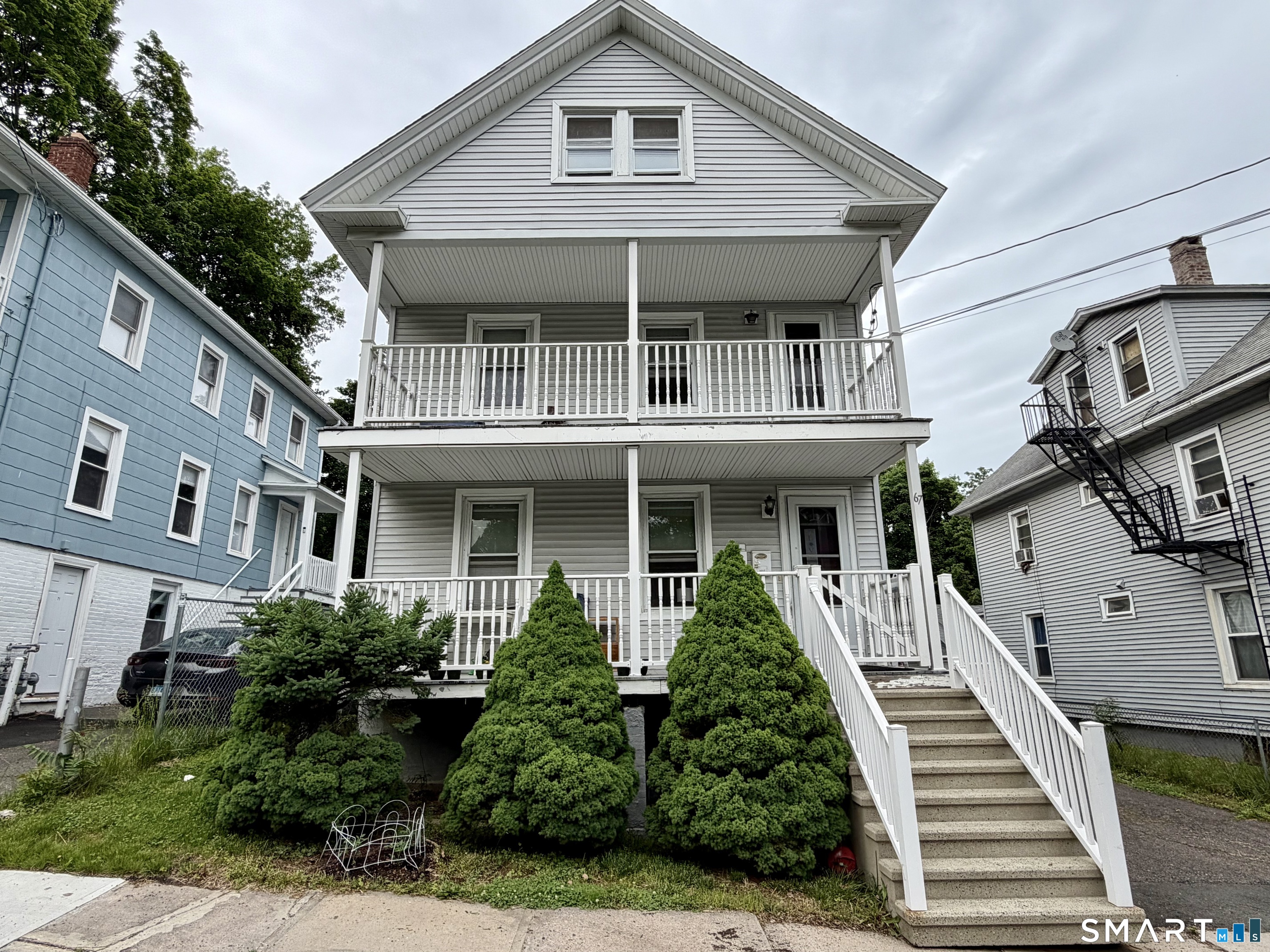67 Pine Street Meriden, CT 06451 - Photo 2 of 34 a front view of a house with windows
