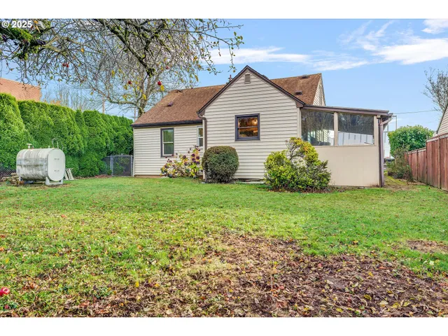 a view of a yard with a tree