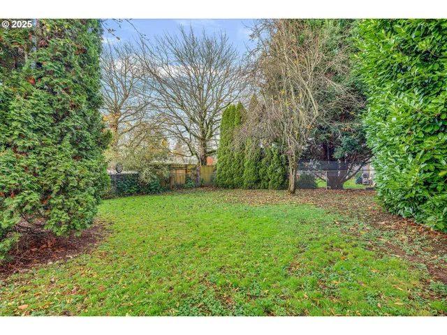 a backyard of a house with lots of green space