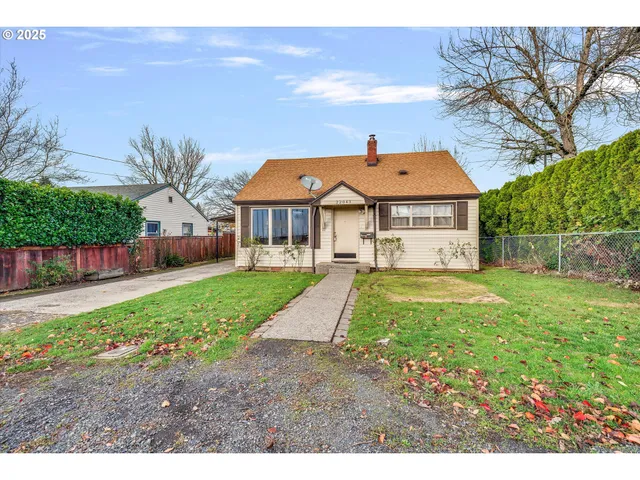 a house view with a sitting space and garden
