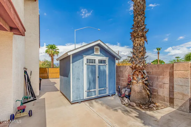 a view of a house with backyard space and garden