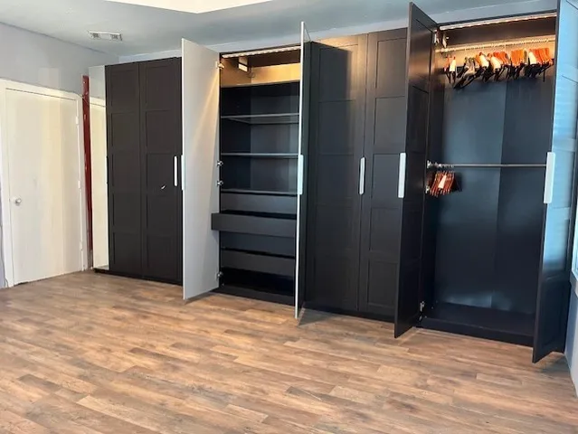 a view of room with walk in closet and window