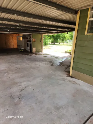 a view of an empty room with a balcony