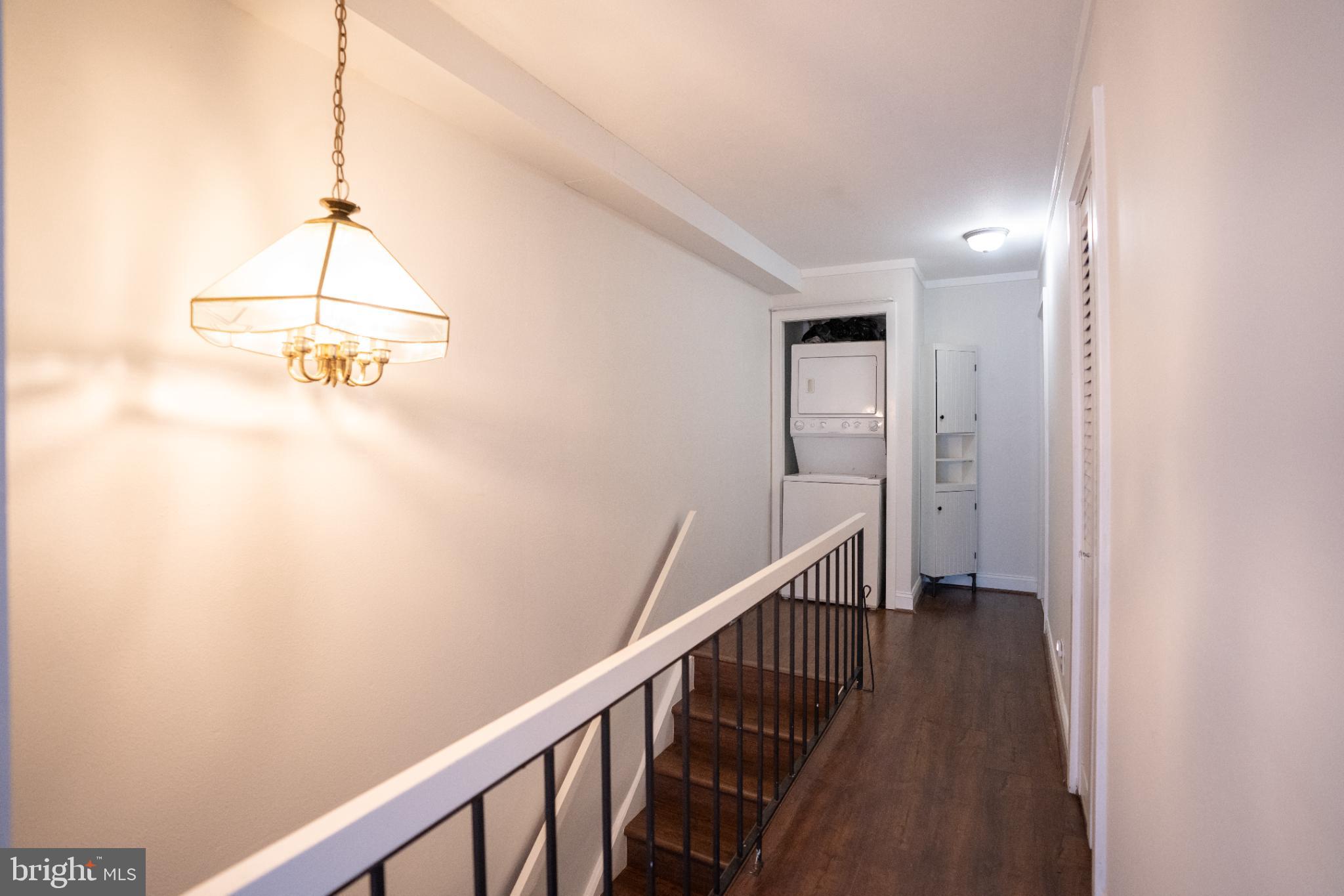 573 Summit House West Chester, PA 19382 - Photo 13 of 20 a view of a hallway with wooden floor