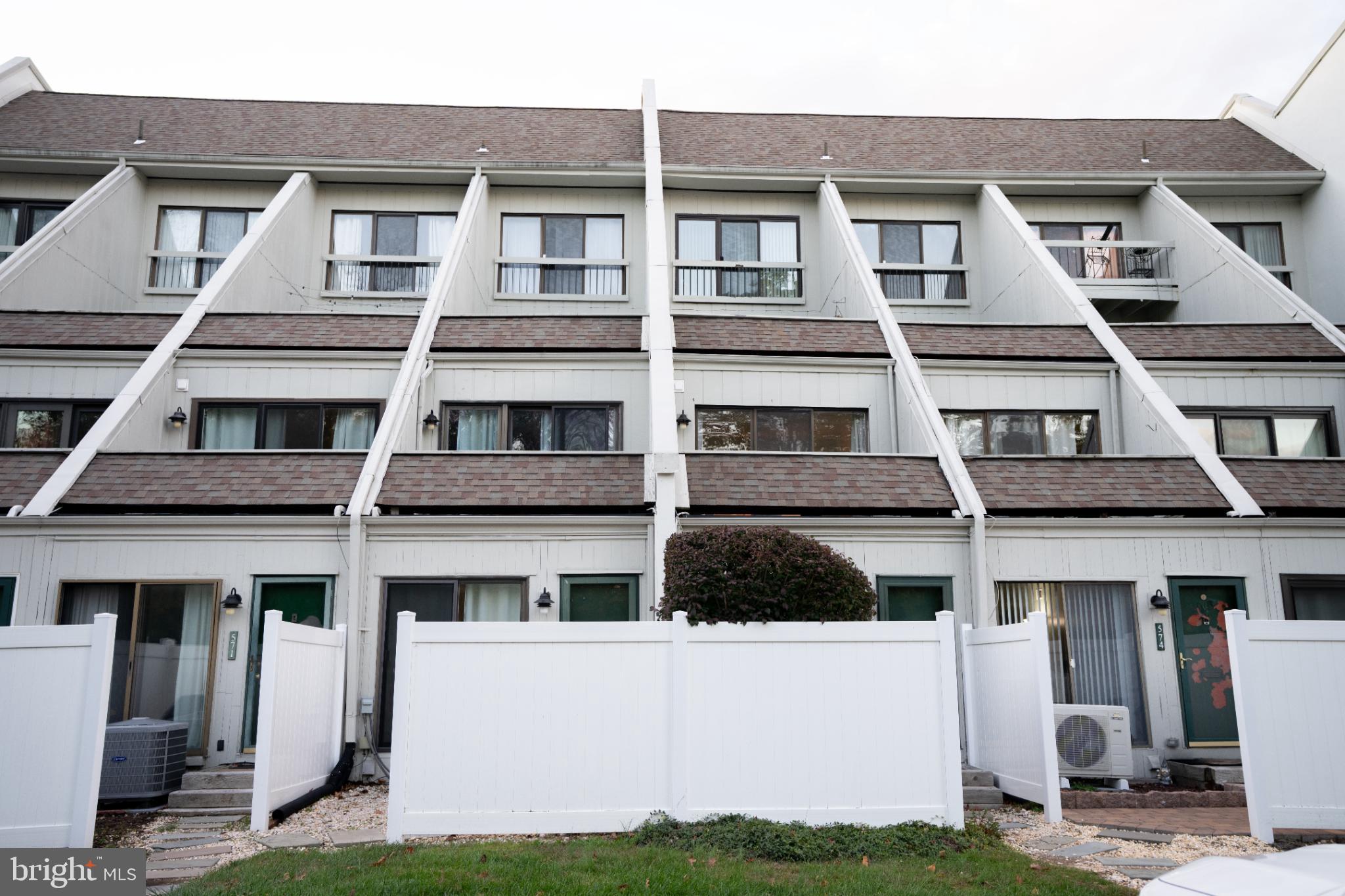 573 Summit House West Chester, PA 19382 - Photo 15 of 20 a front view of a building with a yard