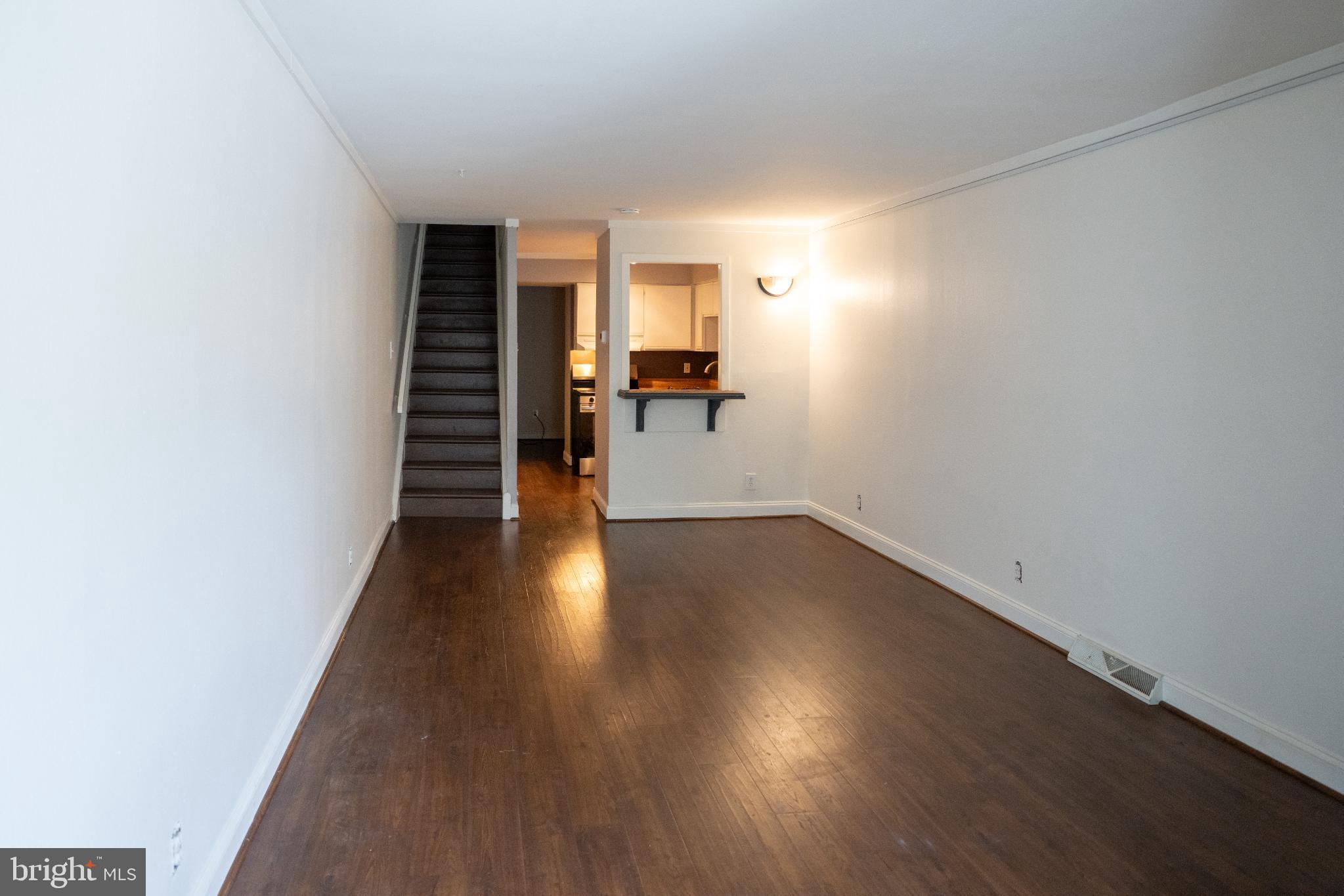 573 Summit House West Chester, PA 19382 - Photo 2 of 20 a view of a hallway with wooden floor and stairs
