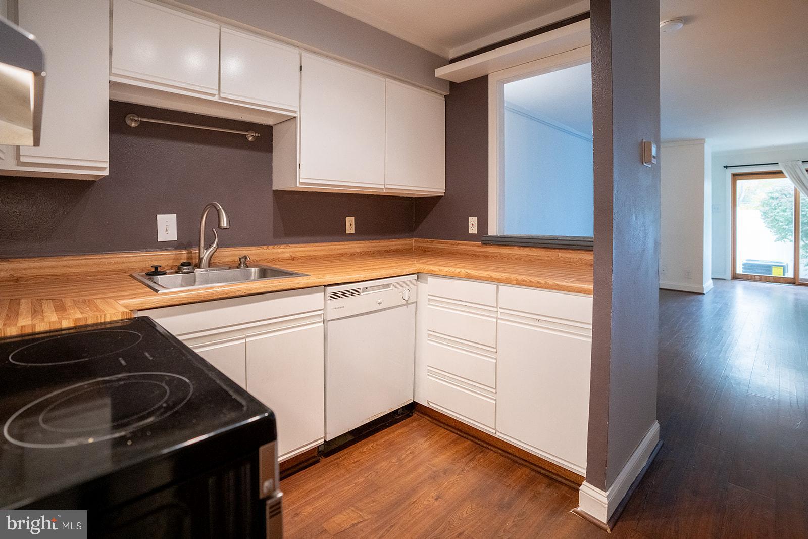 573 Summit House West Chester, PA 19382 - Photo 3 of 20 a kitchen with a sink stove and cabinets