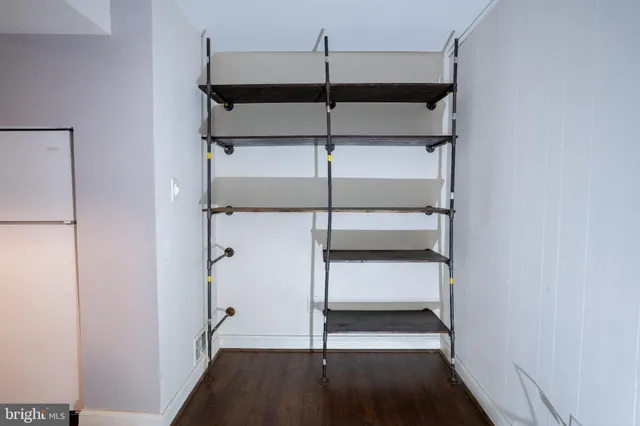 a view of a room with racks on the wall
