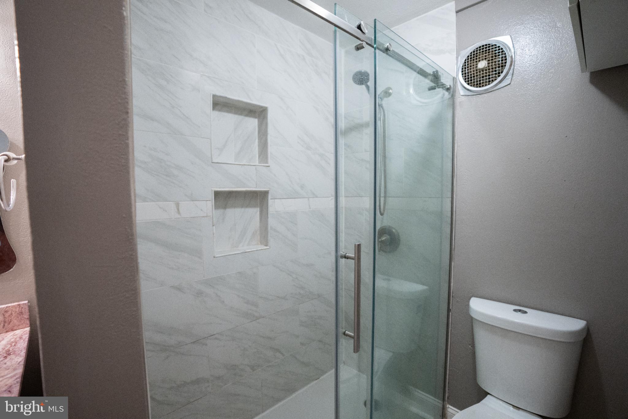 573 Summit House West Chester, PA 19382 - Photo 8 of 20 a bathroom with a shower a toilet and a sink