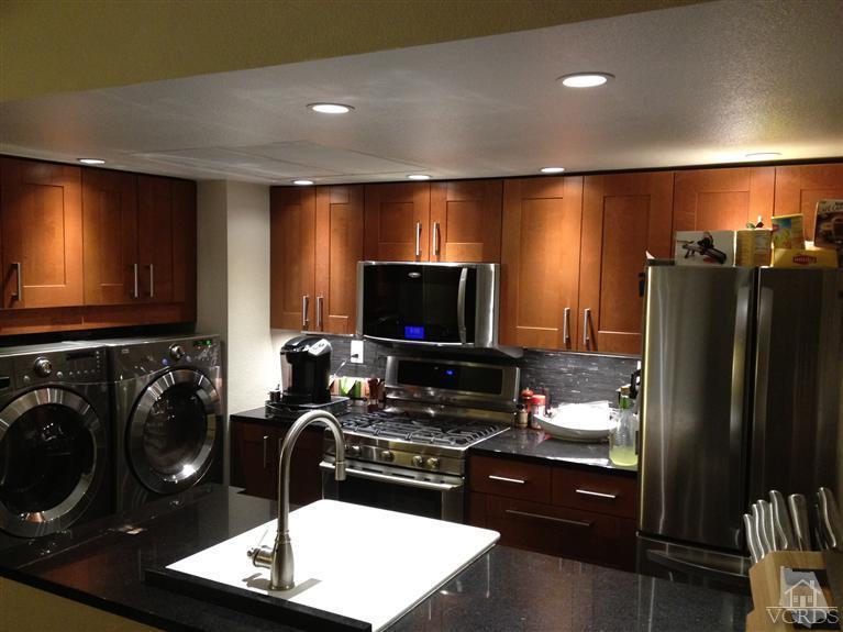 4549 Alamo Street, Unit B Simi Valley, CA 93063 - Photo 2 of 5 a kitchen with a refrigerator and a sink
