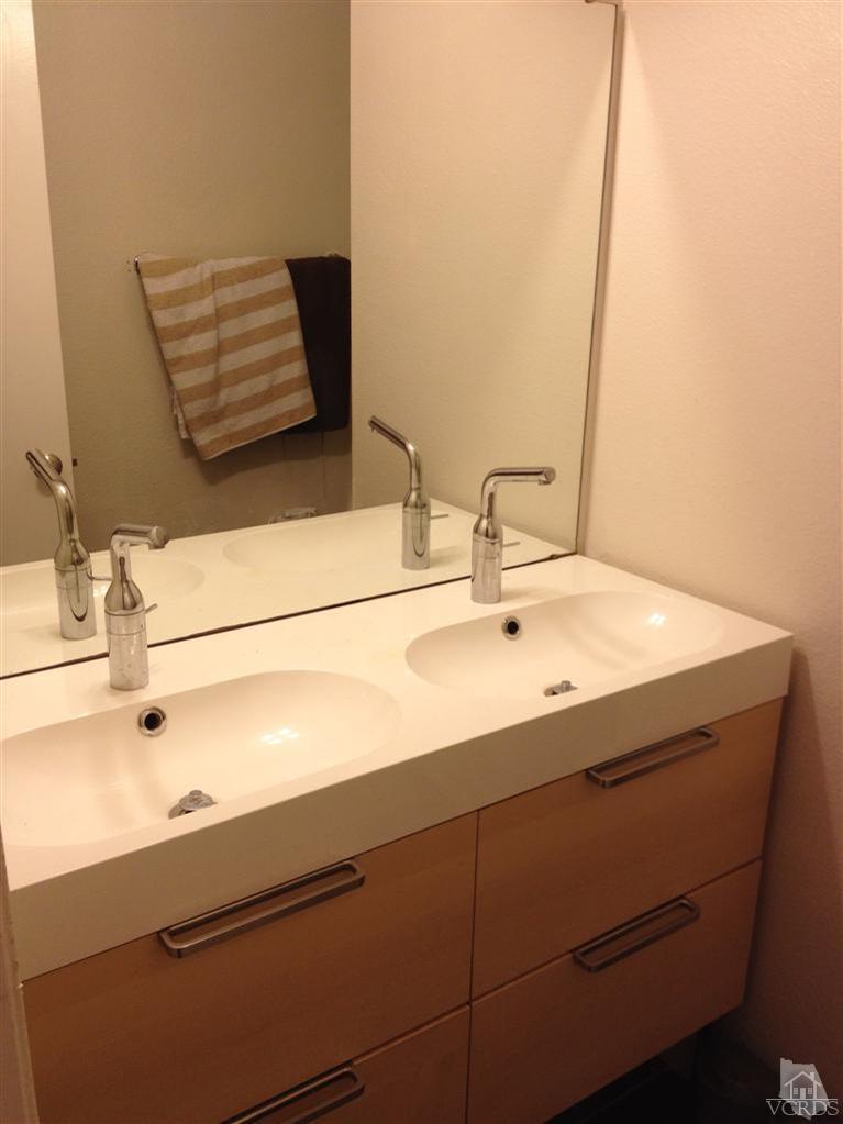 4549 Alamo Street, Unit B Simi Valley, CA 93063 - Photo 4 of 5 a bathroom with a sink and a mirror