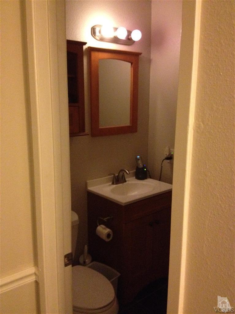 4549 Alamo Street, Unit B Simi Valley, CA 93063 - Photo 5 of 5 a bathroom with a sink vanity mirror and toilet