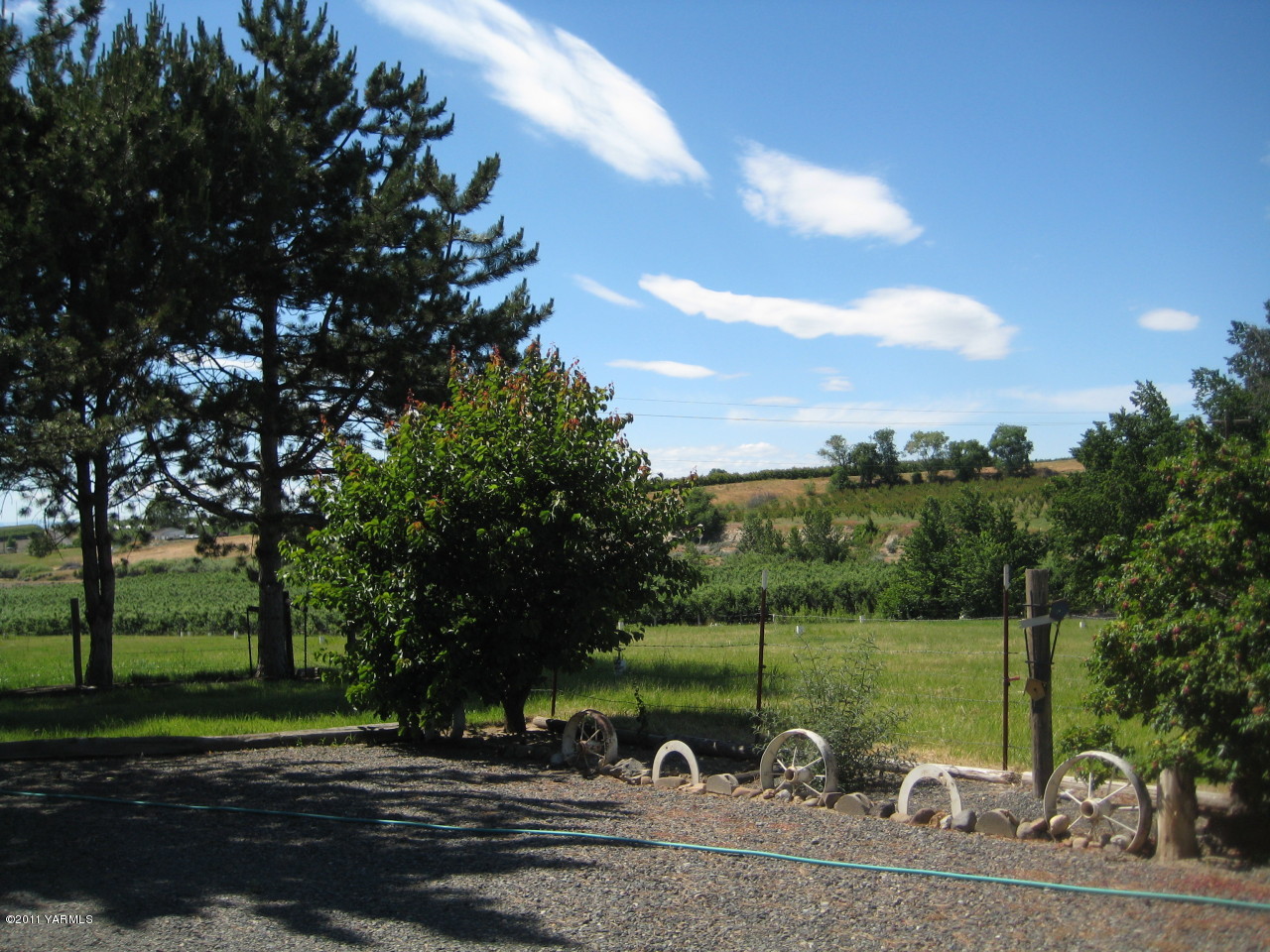 4572 Lombard Loop Road Zillah, WA 98953 - Photo 26 of 33 a view of a lake from a yard