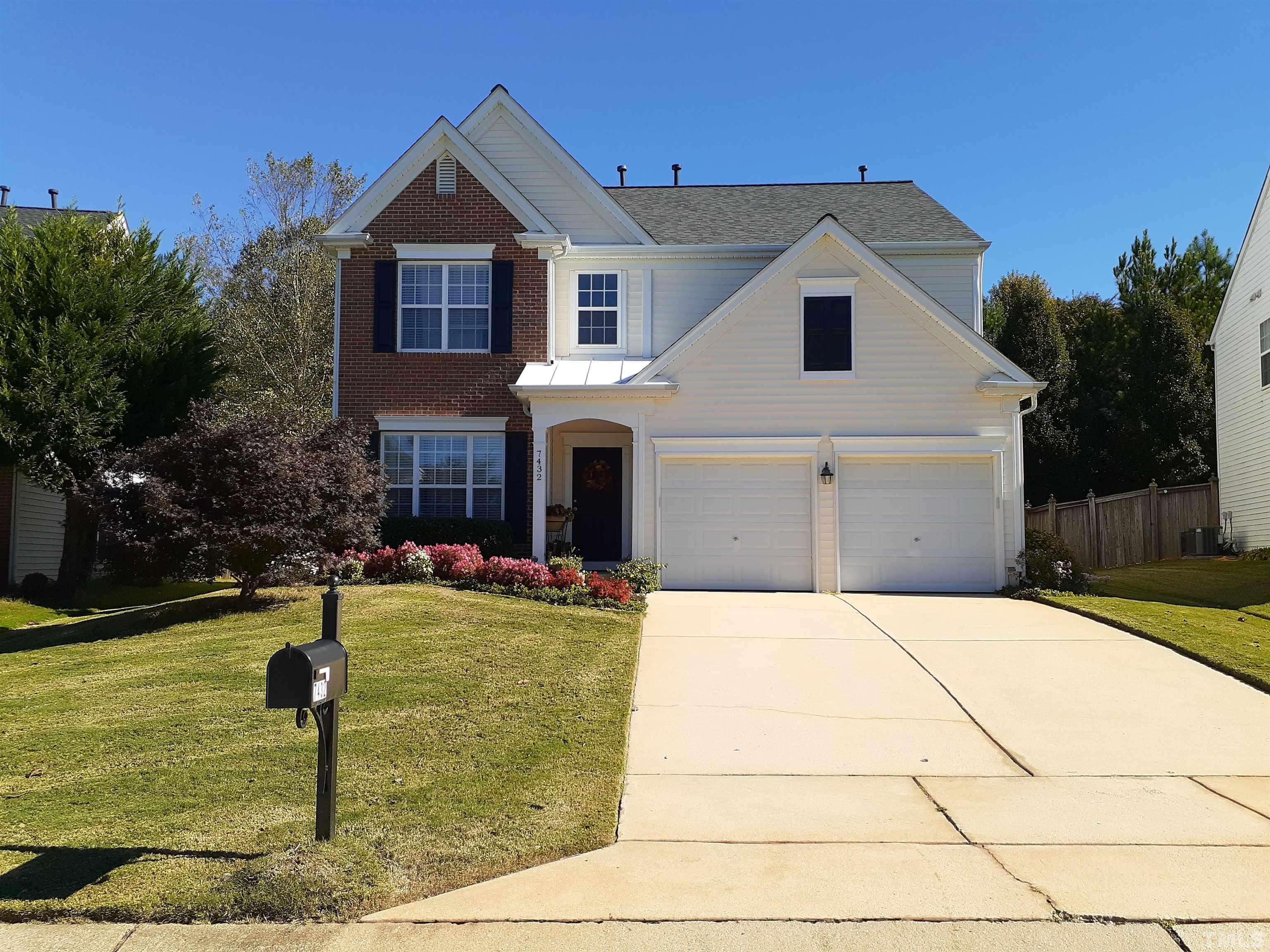 7432 Silver View Lane Raleigh, NC 27613 - Photo 2 of 28 a front view of a house with swimming pool