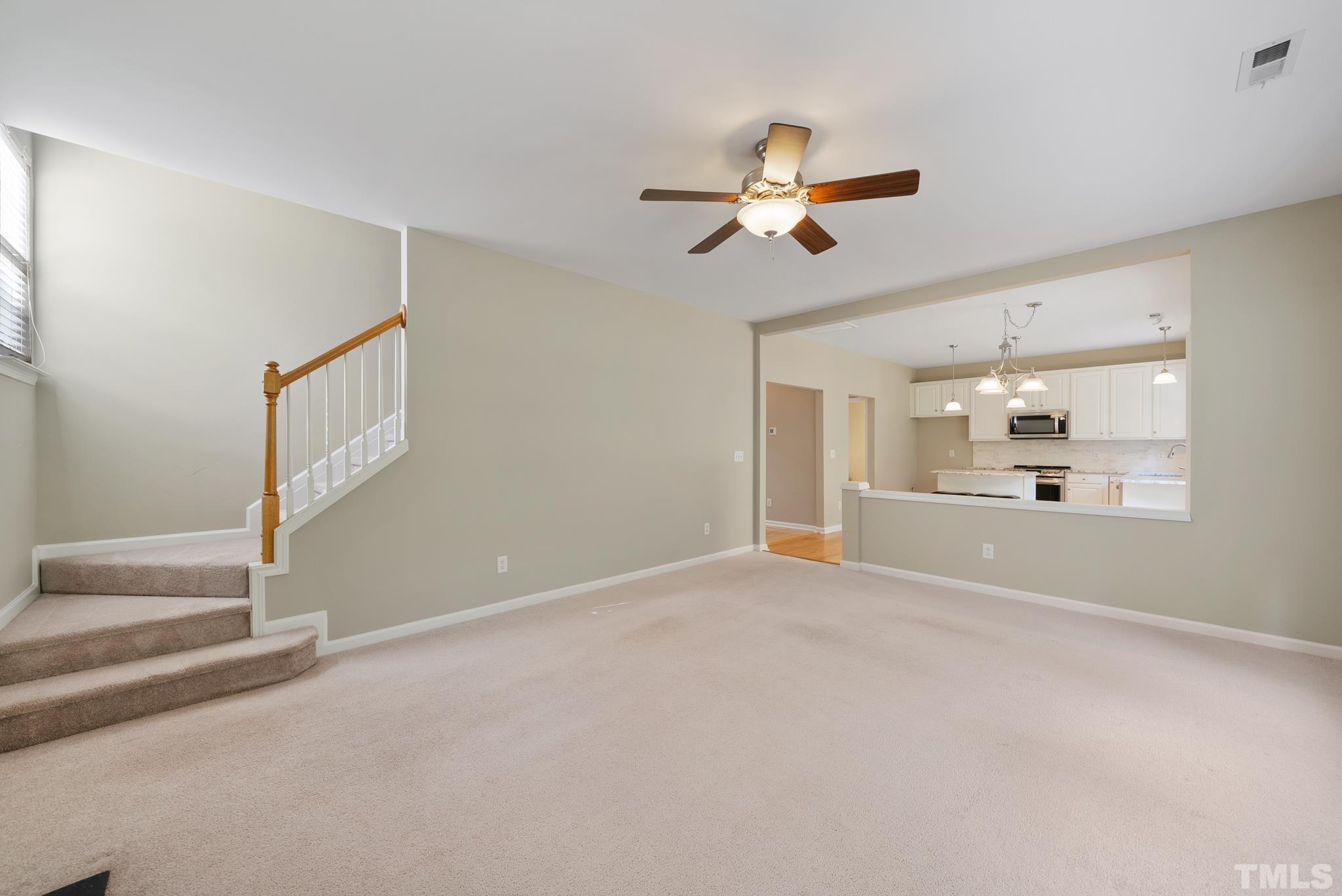 7432 Silver View Lane Raleigh, NC 27613 - Photo 13 of 28 a view of a livingroom with a ceiling fan