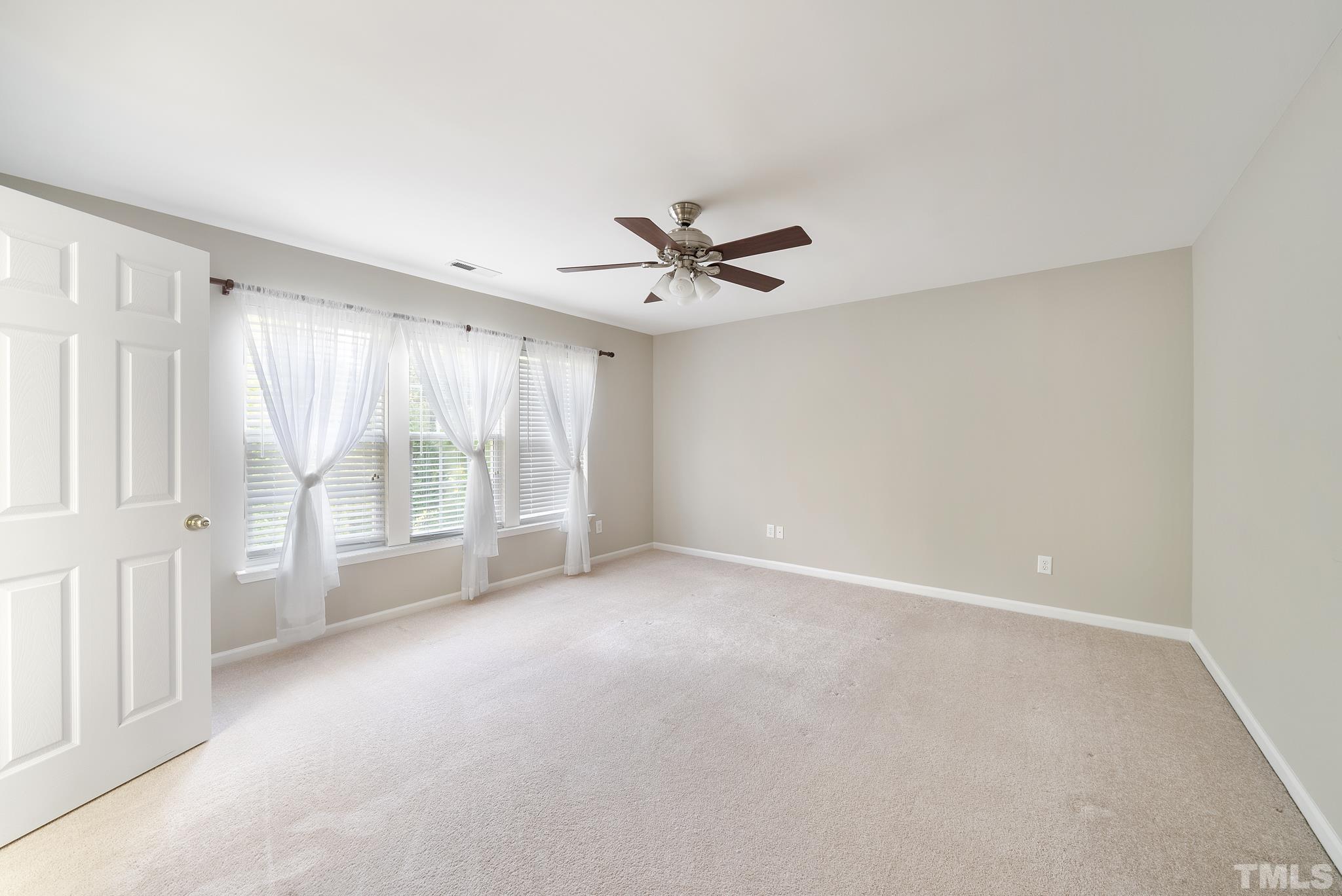 7432 Silver View Lane Raleigh, NC 27613 - Photo 14 of 28 a view of an empty room with a window