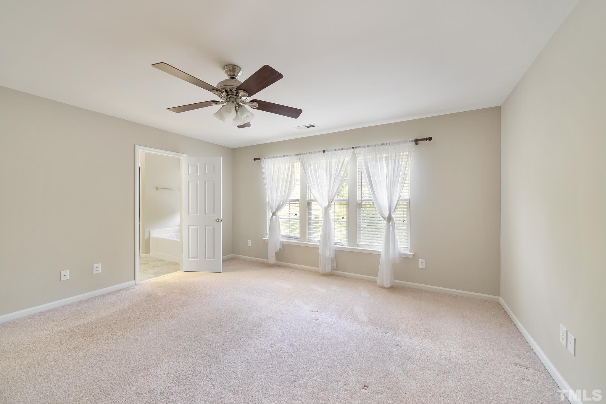 7432 Silver View Lane Raleigh, NC 27613 - Photo 15 of 28 a view of an empty room with a window