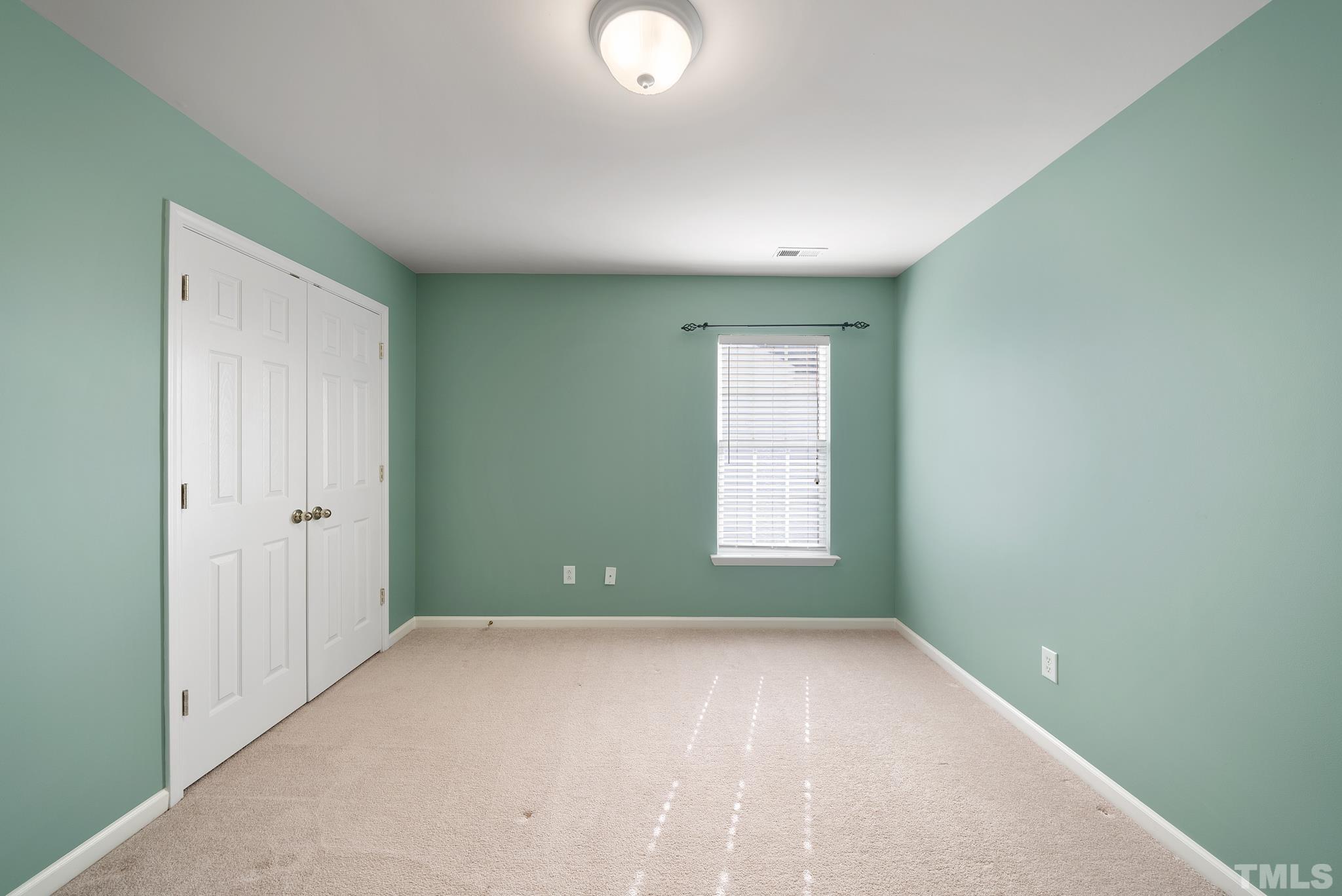 7432 Silver View Lane Raleigh, NC 27613 - Photo 19 of 28 an empty room with a window