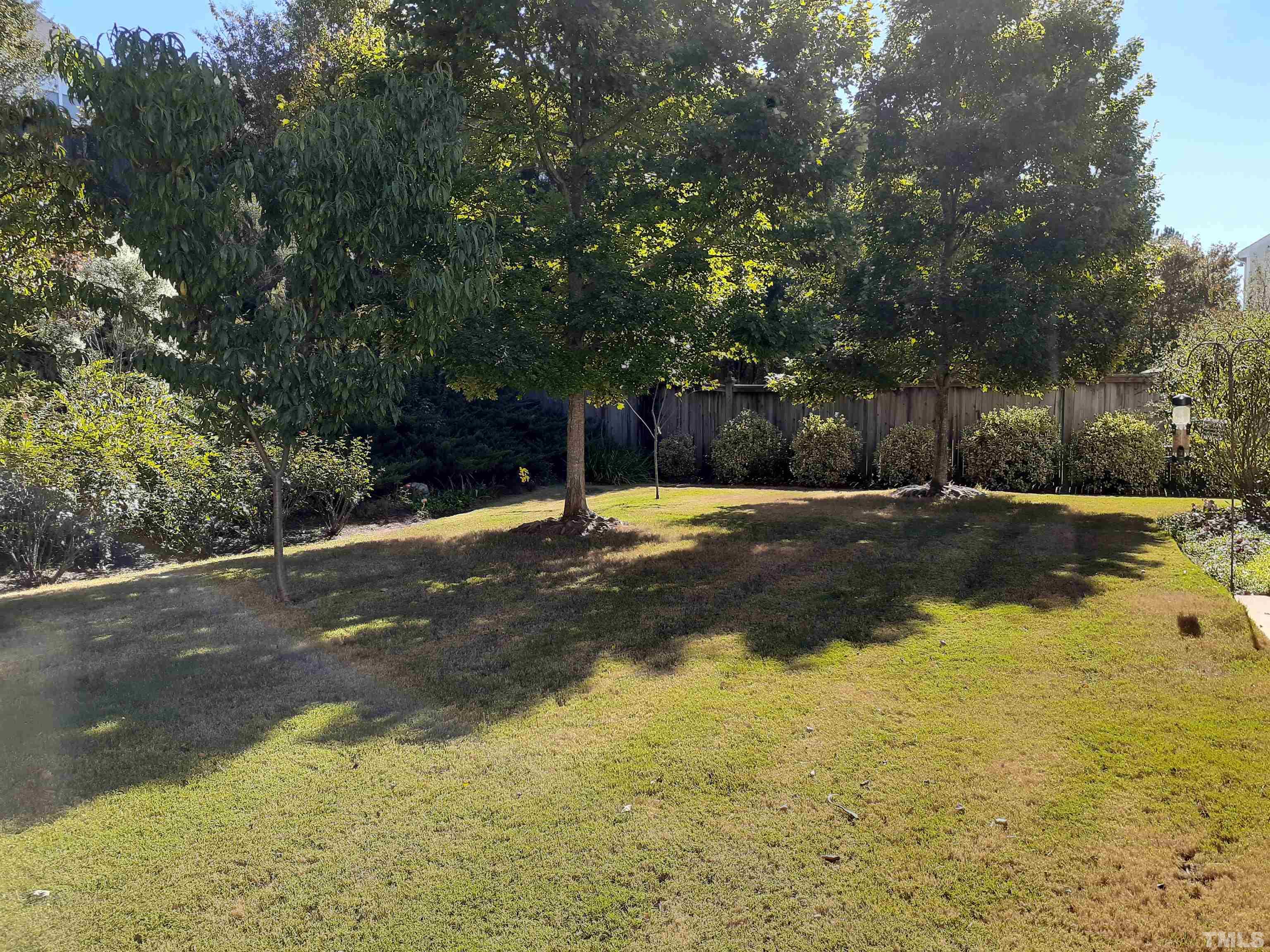 7432 Silver View Lane Raleigh, NC 27613 - Photo 5 of 28 a swimming pool with an outdoor space and trees