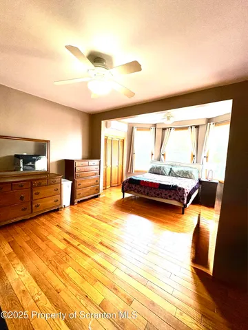 a room with furniture and a large window