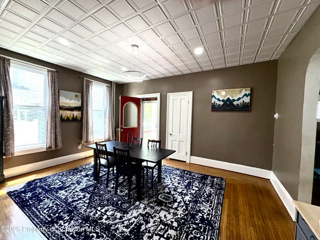 a living room with a rug