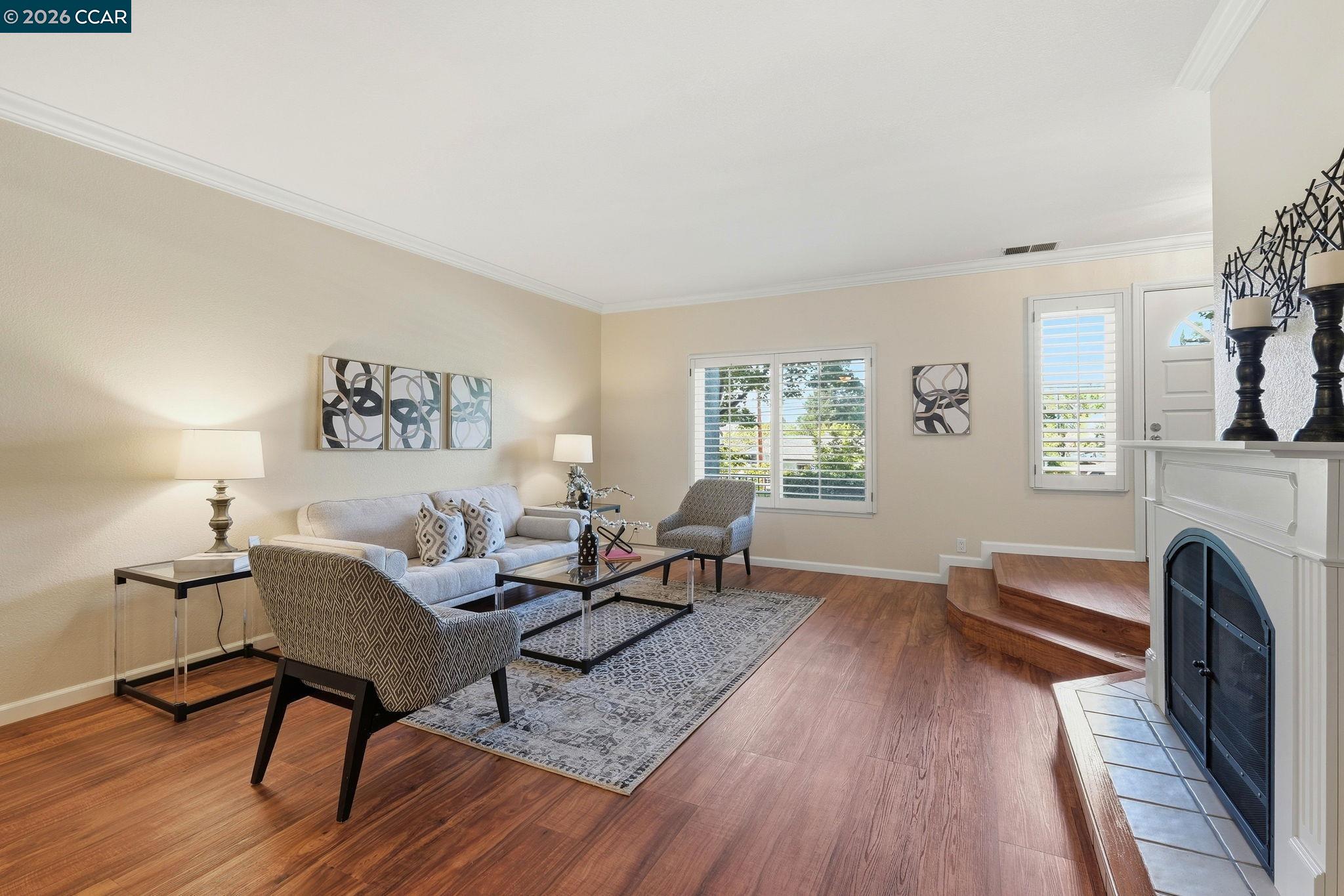 1707 Geary Road Walnut Creek, CA 94597 - Photo 9 of 43 a living room with furniture a fireplace and a window