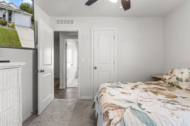 a bedroom with a bed and cabinets
