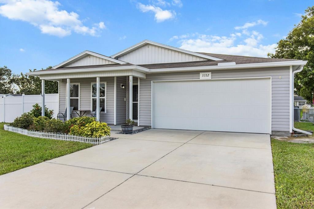 3332 Lambert Avenue Spring Hill, FL 34608 - Photo 2 of 30 a front view of a house with garden