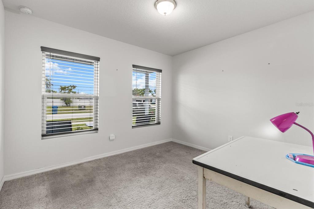 3332 Lambert Avenue Spring Hill, FL 34608 - Photo 23 of 30 a view of an empty room with a window