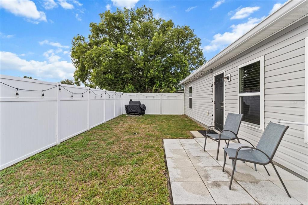 3332 Lambert Avenue Spring Hill, FL 34608 - Photo 26 of 30 a view of backyard with seating space