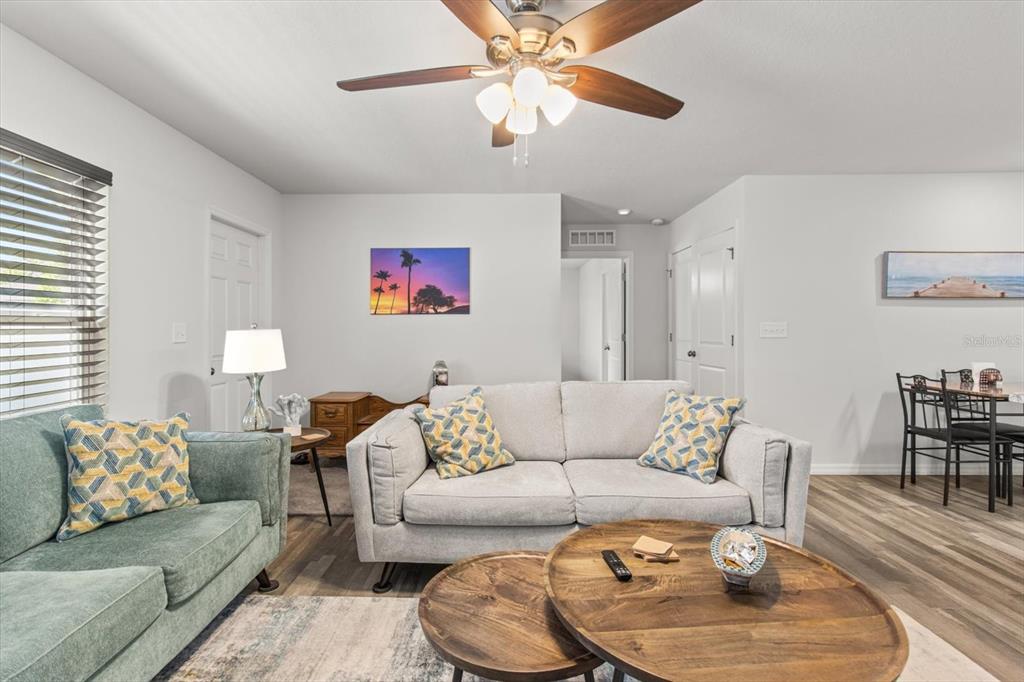 3332 Lambert Avenue Spring Hill, FL 34608 - Photo 6 of 30 a living room with furniture and a chandelier