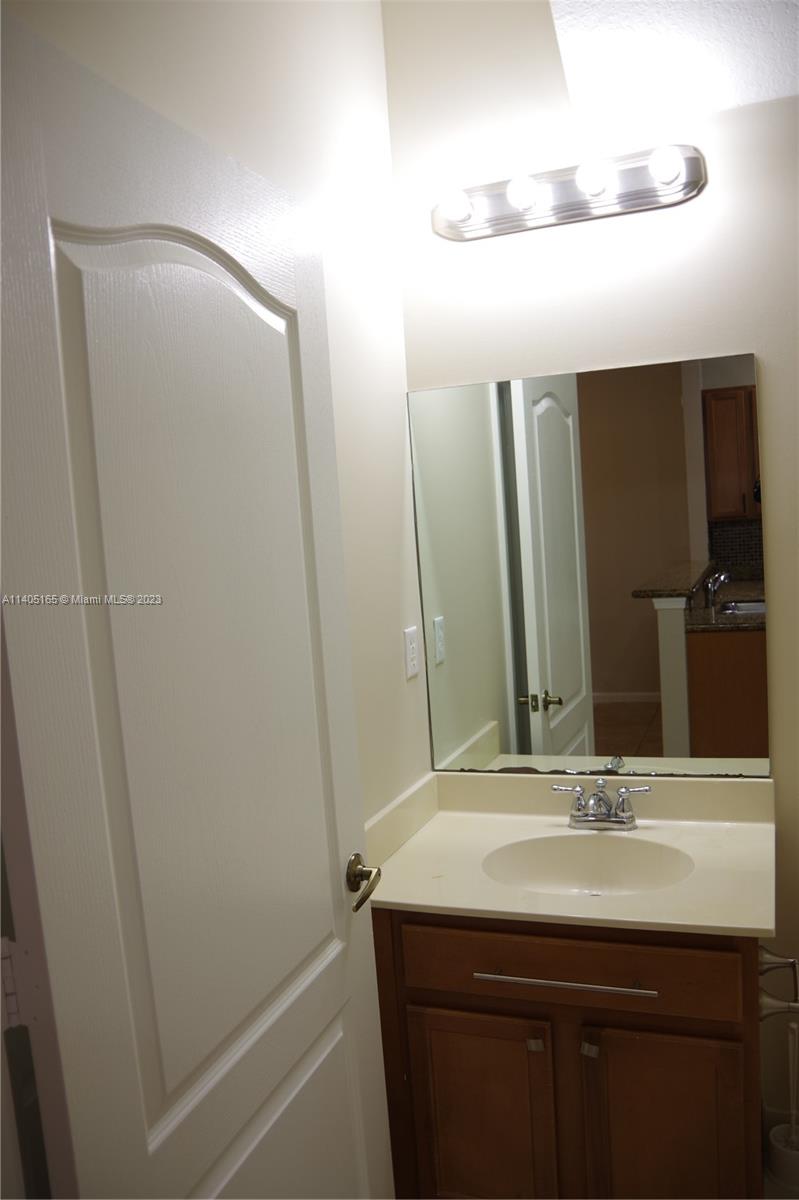 Walden Miami Gardens, FL 33169 - Photo 11 of 33 a bathroom with a sink and a mirror