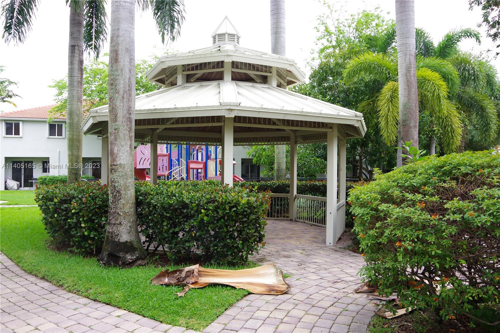 Walden Miami Gardens, FL 33169 - Photo 29 of 33 a front view of a house with garden