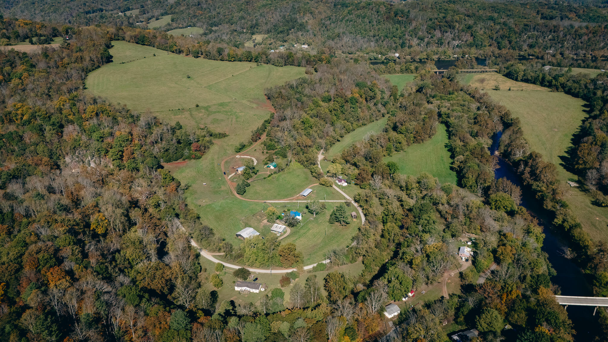 0 Betty Baker Road Hiwassee, VA 24347 - Photo 7 of 19 an aerial view of a residential houses with outdoor space and trees all around