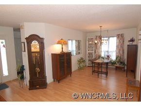 73 Forest Berry Road Fletcher, NC 28732 - Photo 3 of 7 a view of a livingroom with furniture window and wooden floor
