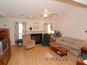 73 Forest Berry Road Fletcher, NC 28732 - Photo 4 of 7 a living room with furniture and a fireplace
