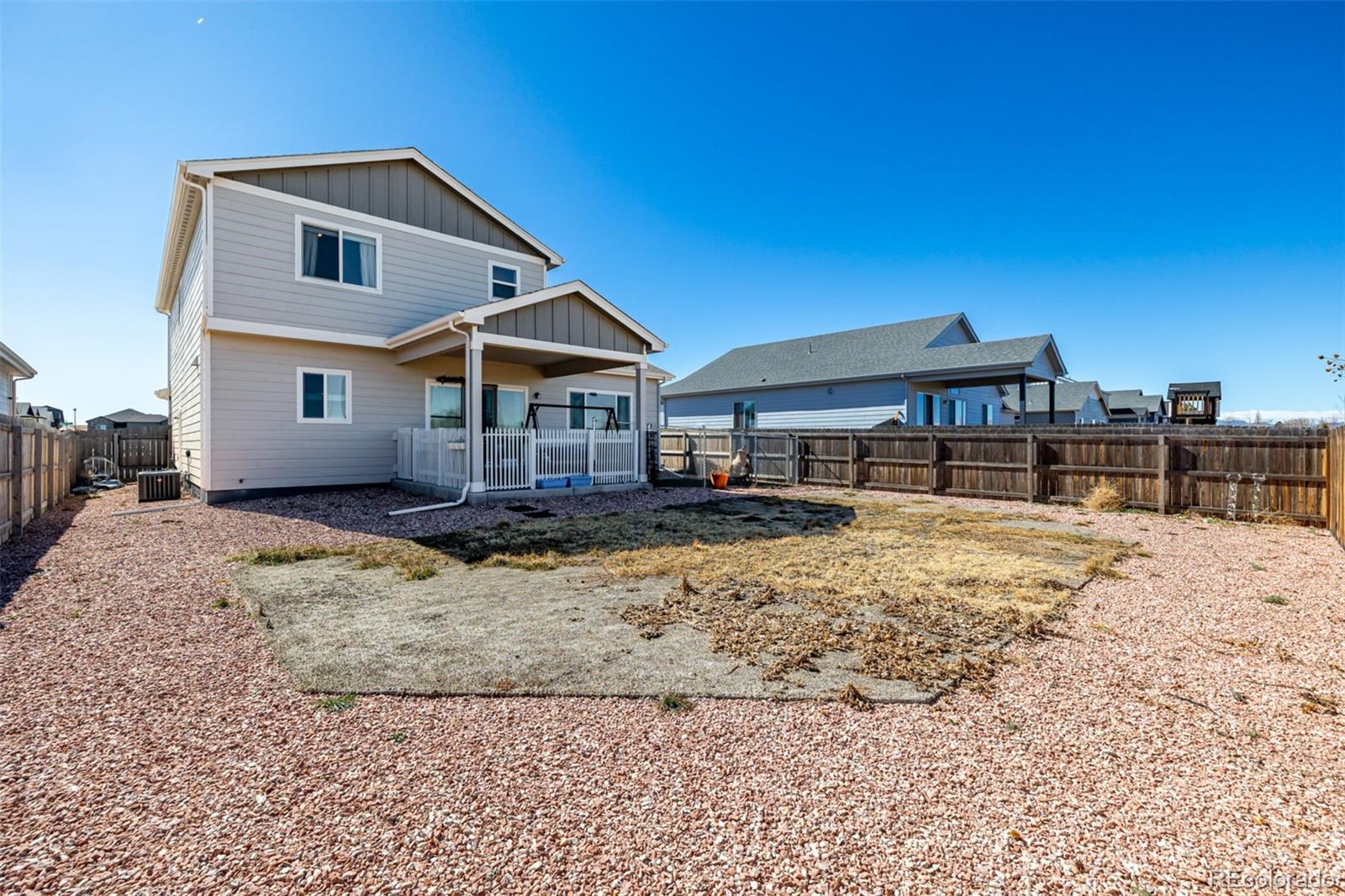 1875 Rancher Drive Milliken, CO 80543 - Photo 33 of 50 a front view of a house with a yard