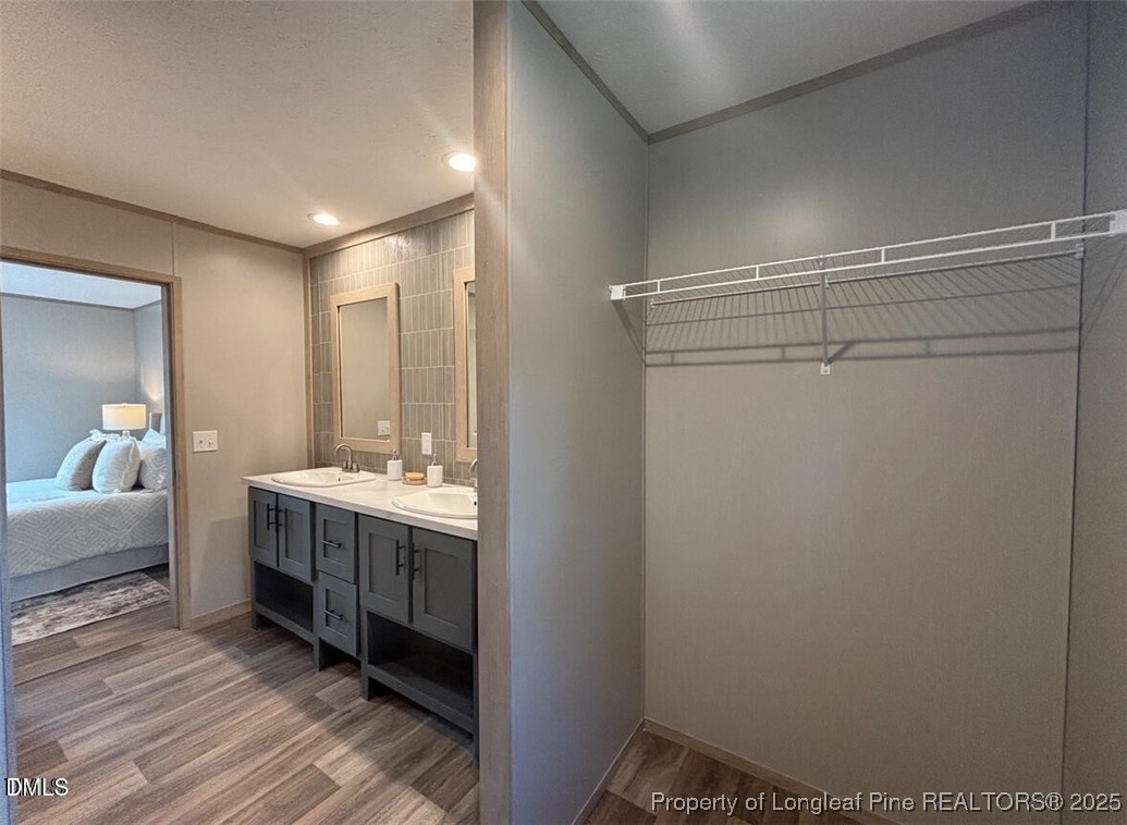 385 Page Road Godwin, NC 28344 - Photo 13 of 18 a bathroom with a double vanity sink and a mirror