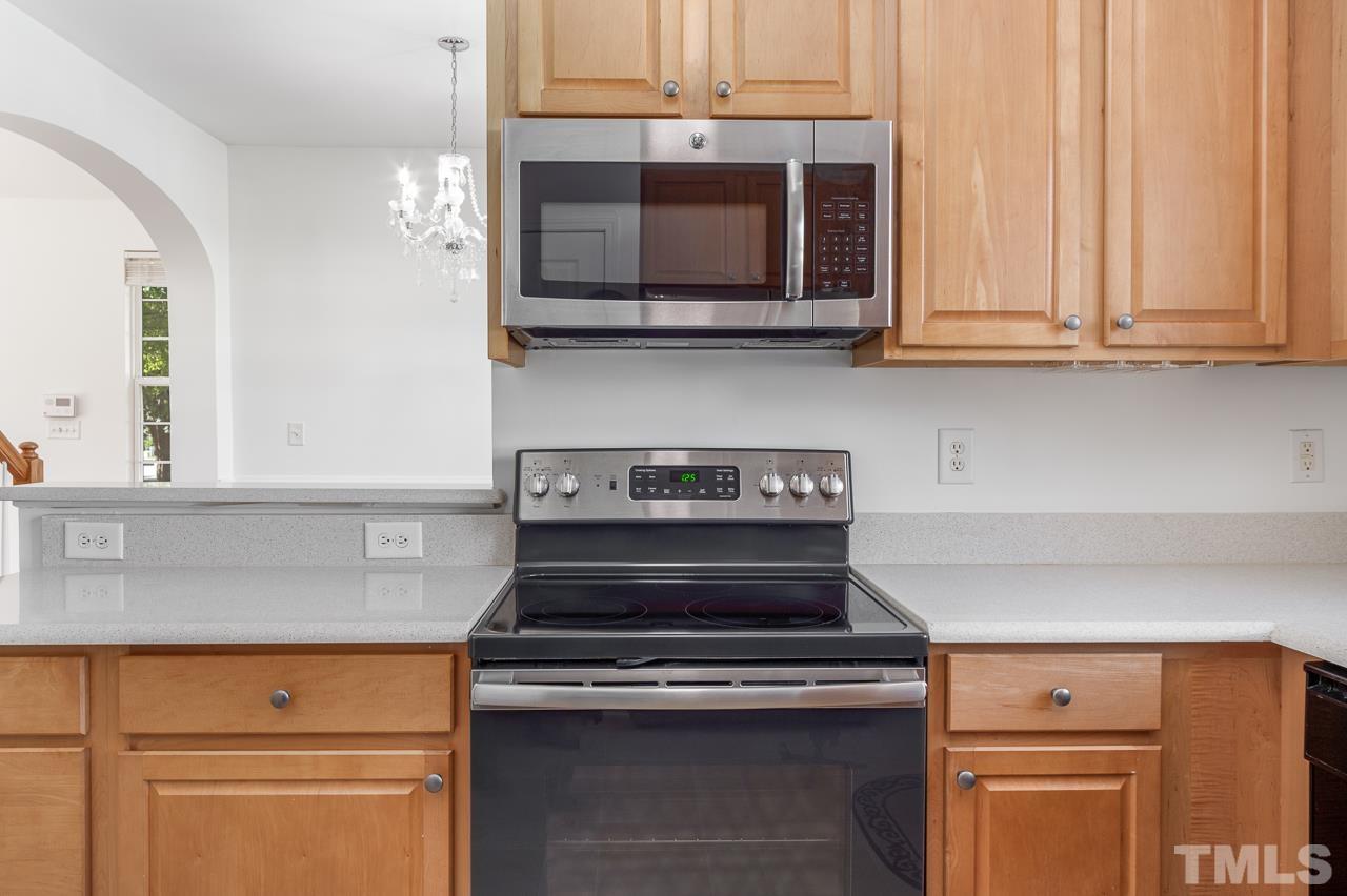 4 Cranbrook Court Durham, NC 27713 - Photo 12 of 30 a stove top oven sitting inside of a kitchen