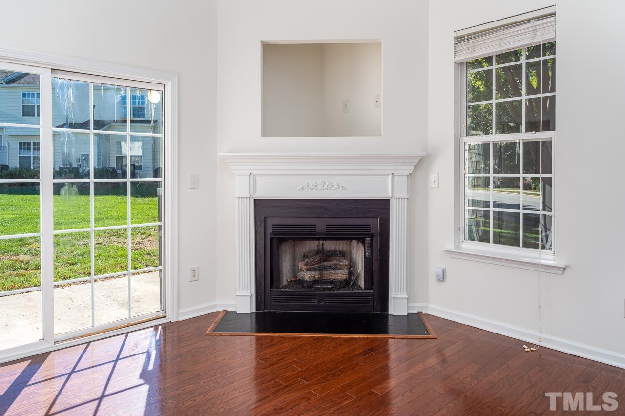 4 Cranbrook Court Durham, NC 27713 - Photo 7 of 30 a living room with a fireplace and window
