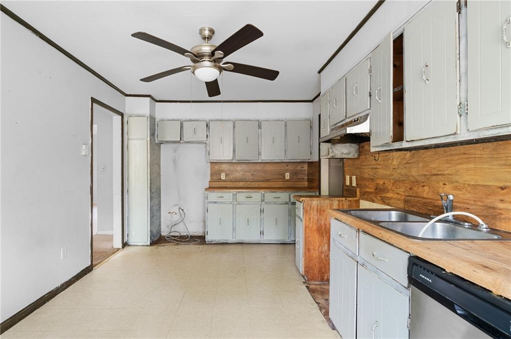 1973 Pinetree Trail Gainesville, GA 30501 - Photo 11 of 26 a kitchen with a sink refrigerator and cabinets