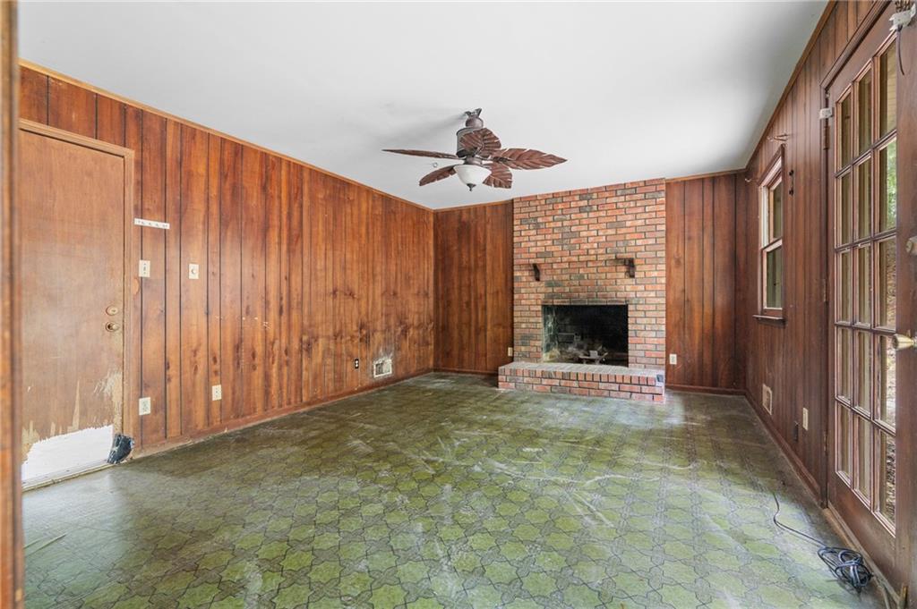 1973 Pinetree Trail Gainesville, GA 30501 - Photo 15 of 26 a view of an empty room with a fireplace and a window