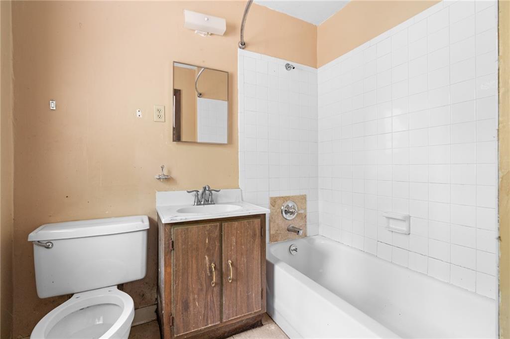 1973 Pinetree Trail Gainesville, GA 30501 - Photo 16 of 26 a white toilet sitting next to a bathroom sink