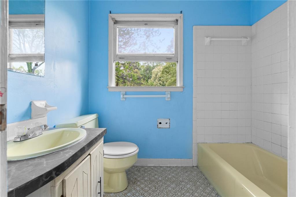 1973 Pinetree Trail Gainesville, GA 30501 - Photo 18 of 26 a bathroom with a sink a toilet and bathtub