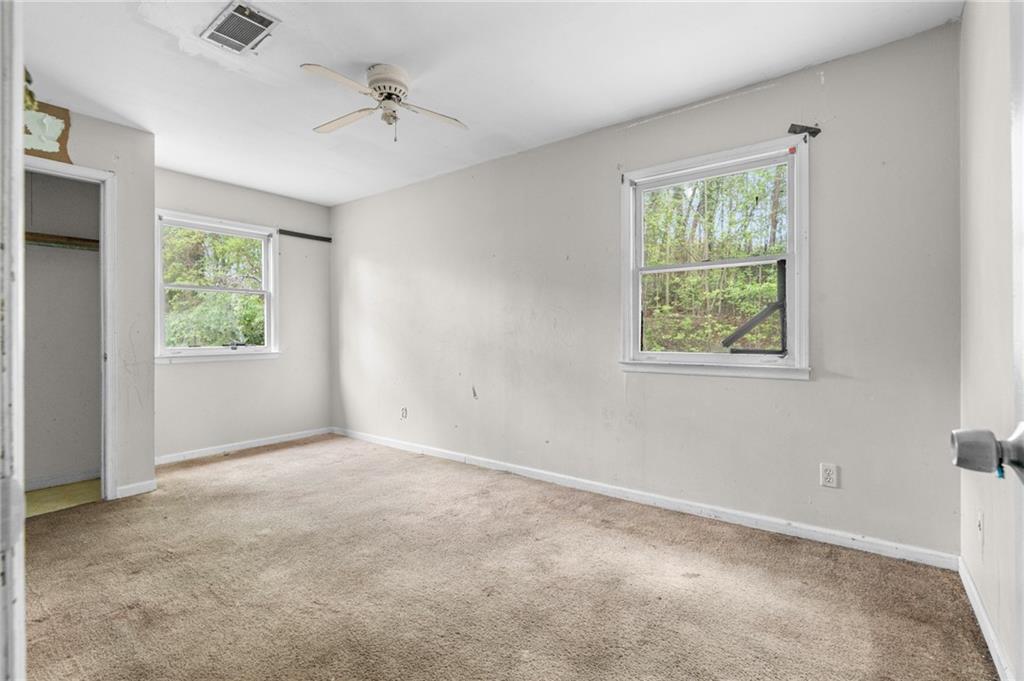 1973 Pinetree Trail Gainesville, GA 30501 - Photo 19 of 26 an empty room with windows and closet