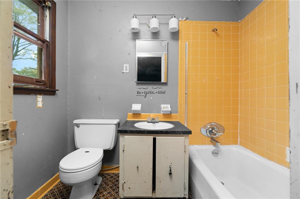 1973 Pinetree Trail Gainesville, GA 30501 - Photo 23 of 26 a bathroom with a sink toilet and shower