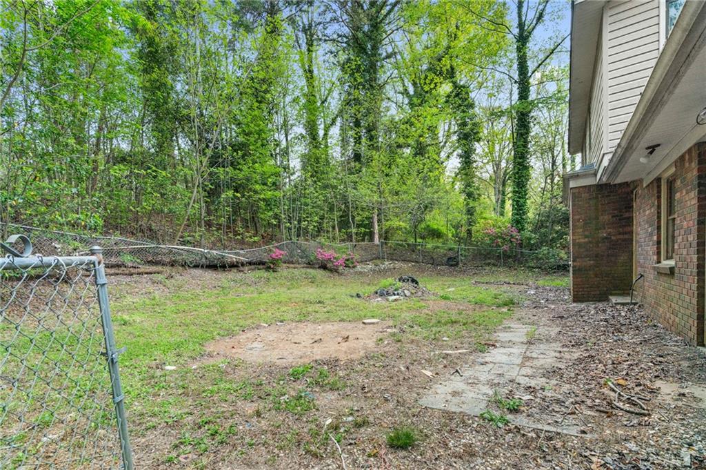 1973 Pinetree Trail Gainesville, GA 30501 - Photo 25 of 26 a backyard of a house with lots of green space