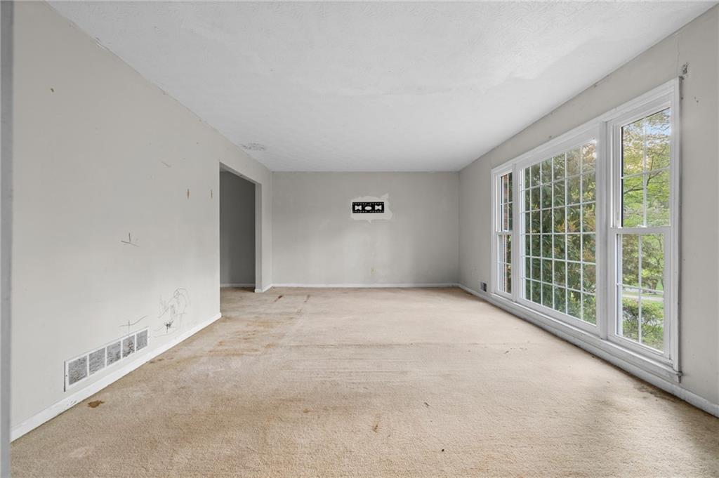 1973 Pinetree Trail Gainesville, GA 30501 - Photo 3 of 26 an empty room with windows